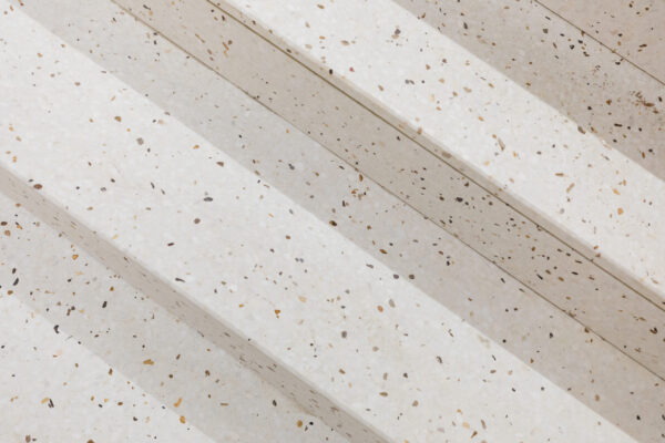 October 2021, images from the regeneration of BAFTA's 195 Piccadilly headquarters, designed by Benedetti Architects with Knight Harwood serving as the principle contractor on the project. Pictured: Detailed views terrazzo flooring in the entrance and lobbies